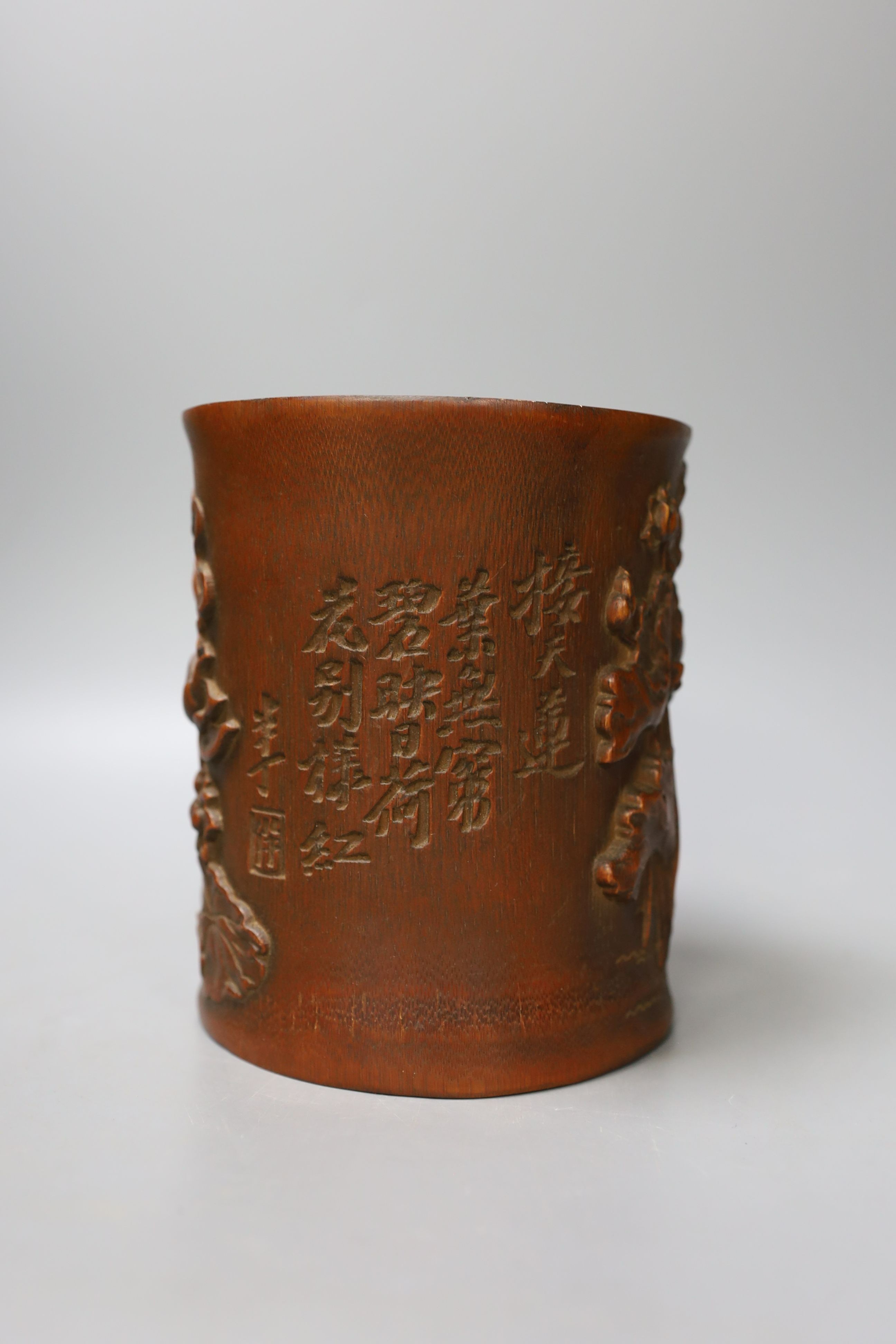 A Chinese carved bamboo brush pot - 15cm tall